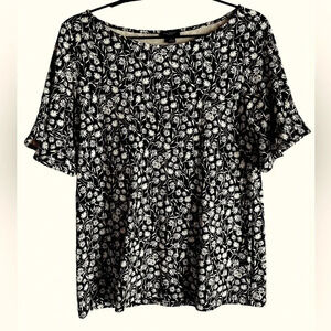 Ann Taylor outlet top. Black with dainty white flowers, ruffled sleeves. Sz S